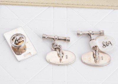Lot 125 - A pair of contemporary silver and enamel cufflinks