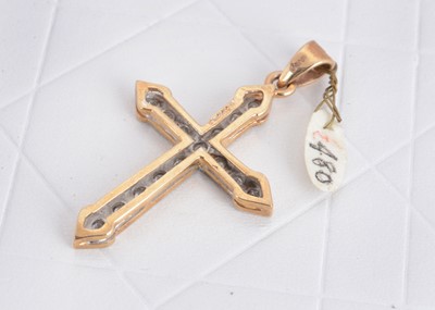 Lot 126 - A 9ct gold diamond set cross pendant