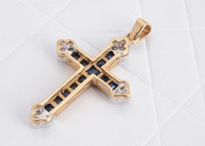 Lot 128 - A 9ct gold sapphire and diamond set cross pendant