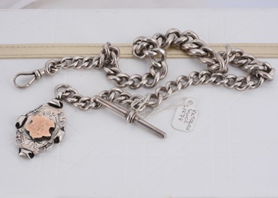 Lot 131 - A Victorian silver curb link graduated watch chain and fob medallion