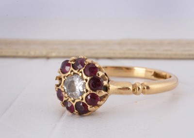 Lot 138 - An 18ct diamond and ruby cluster ring