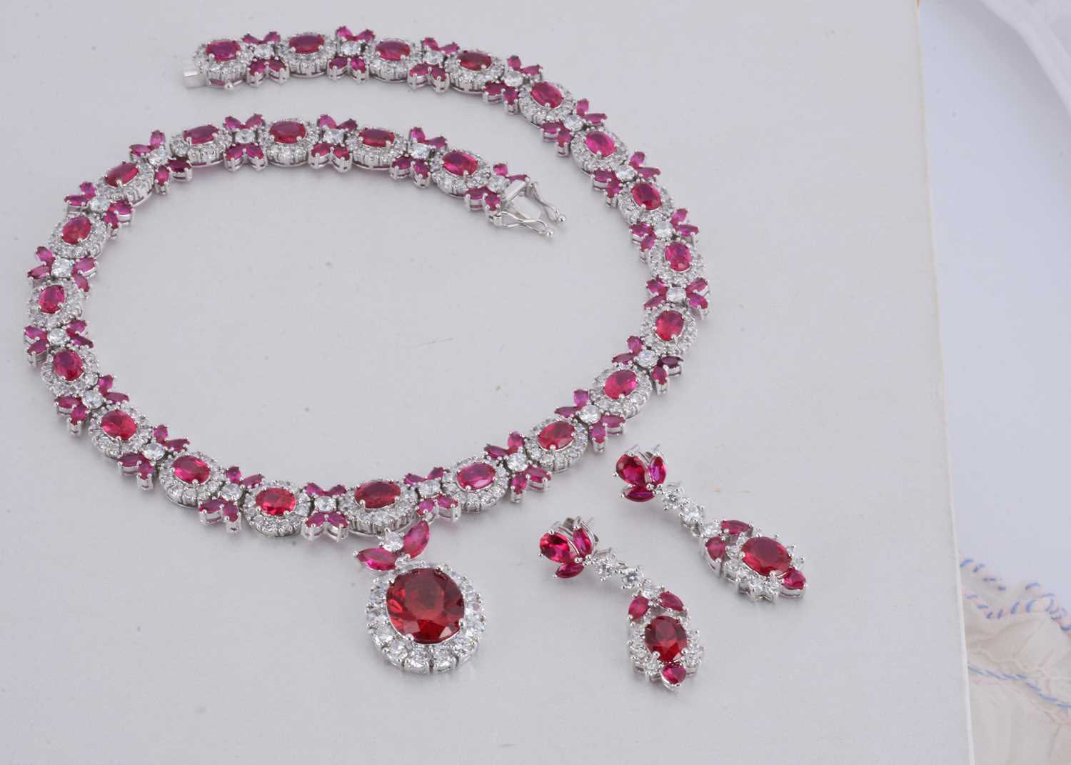 Lot 142 - A paste set chrome plated necklace and matching earring set