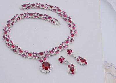 Lot 142 - A paste set chrome plated necklace and matching earring set