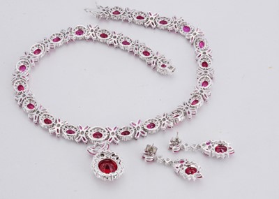 Lot 142 - A paste set chrome plated necklace and matching earring set