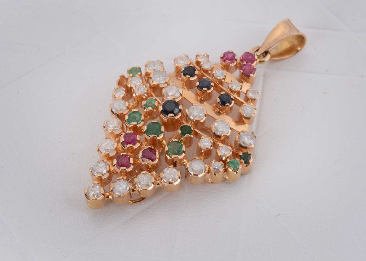 Lot 144 - A continental multi gem set navette shaped pendant