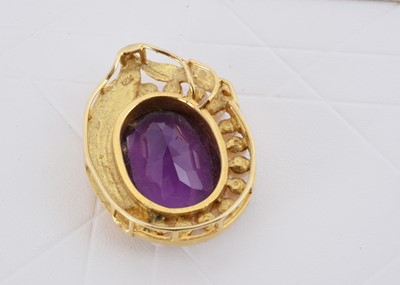 Lot 145 - A continental yellow metal 18k marked amethyst and pearl pendant
