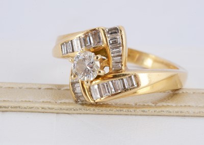 Lot 150 - A yellow metal 750 diamond set cocktail ring