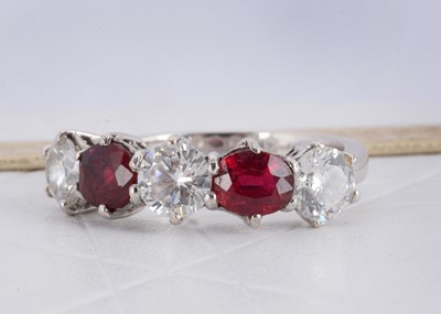 Lot 152 - A ruby and diamond five stone white metal dress ring