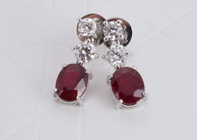 Lot 154 - A pair of 750 marked ruby and diamond drop earrings