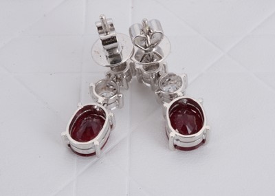 Lot 154 - A pair of 750 marked ruby and diamond drop earrings