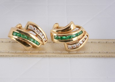 Lot 158 - A pair of continental 18k marked yellow metal emerald and diamond clips