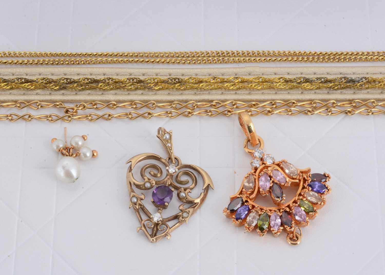 Lot 164 - A 9ct gold amethyst diamond and seed pearl heart shaped pendant