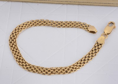 Lot 165 - An Italian 750 marked yellow metal textured mesh bracelet