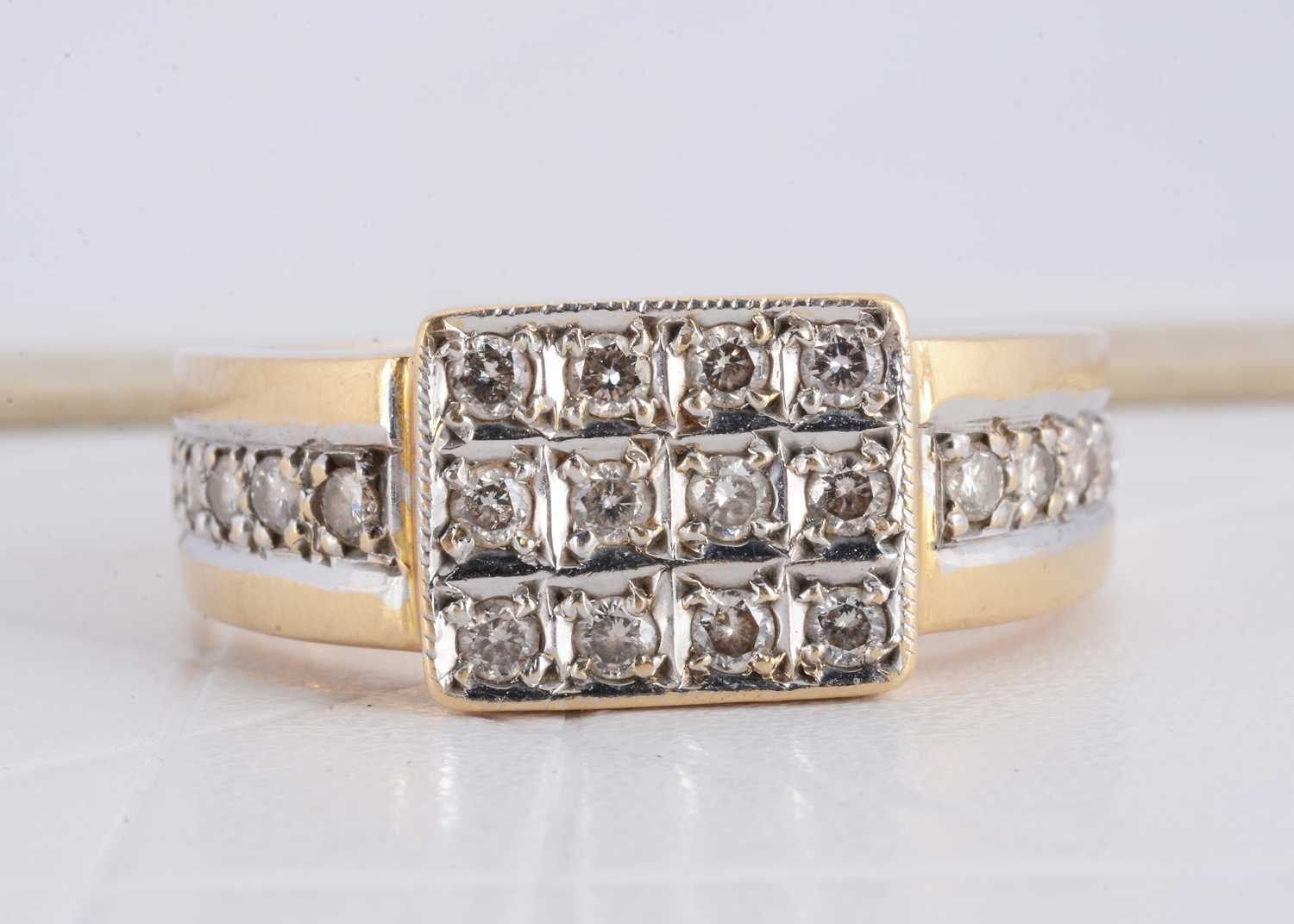 Lot 168 - A continental yellow metal 14k stamped diamond set signet ring