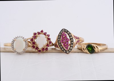 Lot 217 - A collection of four QVC gem set dress rings