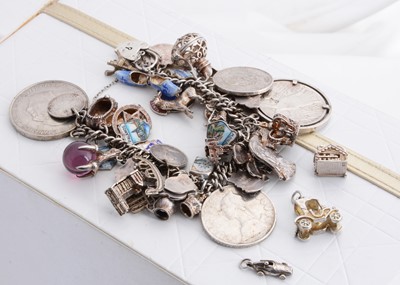 Lot 230 - A silver curb link charm bracelet