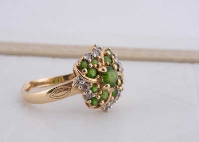 Lot 236 - A continental yellow metal peridot and diamond dress ring