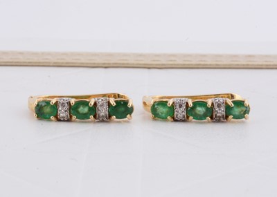 Lot 238 - A pair of Ukrainian 14ct gold emerald and diamond half hoop earrings