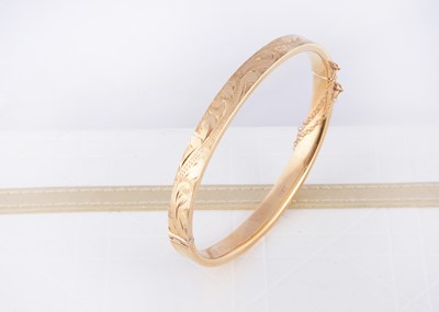 Lot 248 - A 9ct gold hollow hinged bangle