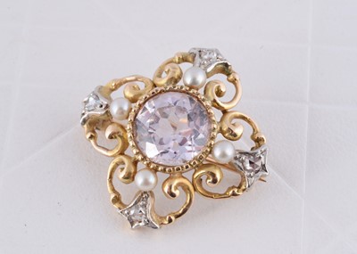 Lot 255 - A two colour gold gem set quatrefoil brooch