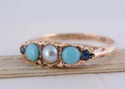 Lot 256 - A 9ct gold turquoise and seed pearl and blue gem set dress ring