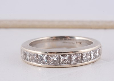 Lot 260 - A white 18ct gold channel set half hoop eternity ring