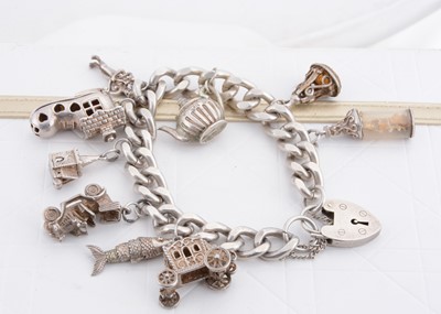 Lot 284 - A silver charm bracelet