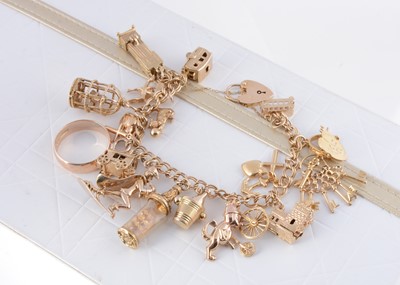 Lot 291 - A 9ct gold charm bracelet