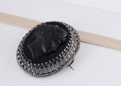 Lot 297 - A Berlin style white metal and glass cameo oval brooch