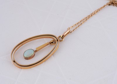 Lot 298 - An early 20th Century opal oval drop pendant