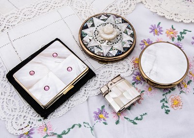Lot 311 - Mother of pearl, shell and abalone mounted gilt metal vintage compacts