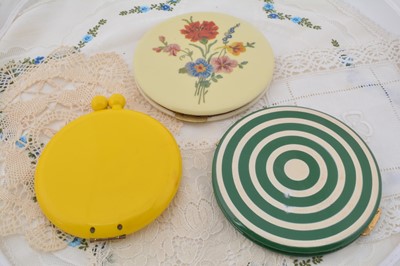 Lot 316 - Three large circular plastic American compacts
