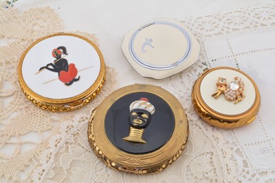 Lot 324 - Four Evans compacts