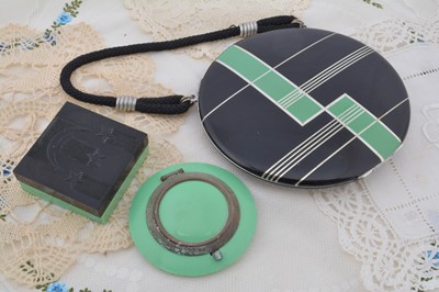 Lot 327 - An Art Deco chrome and plastic green and black circular compact carry all