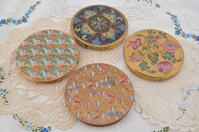 Lot 330 - Four circular British made circular gilt metal compacts