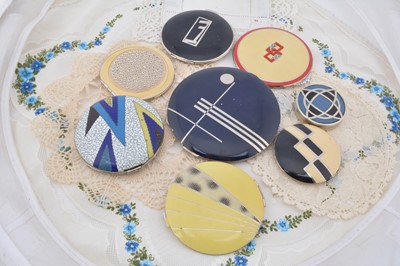 Lot 334 - Eight circular Art Deco chrome and coloured enamel decorated compacts