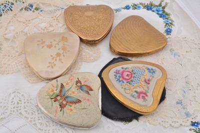 Lot 339 - Five Art Deco Kigu Cherie heart shaped gilt metal and chromed compacts