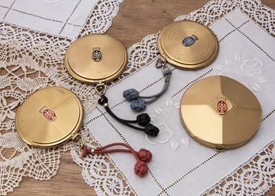 Lot 350 - Three circular gilt metal 1950s Coty compacts