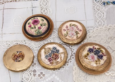 Lot 361 - Five Melissa and other circular gilt metal compacts c1950s
