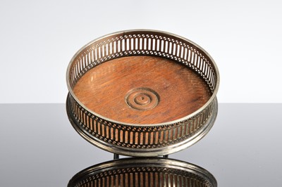 Lot 371 - A 1970s silver and wooden wine bottle coaster from RH & Son