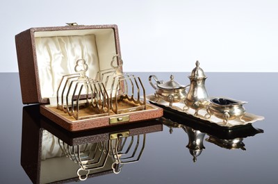 Lot 373 - A cased pair of silver toast racks by Charles Boyton & Son together with a silver cruet set on stand