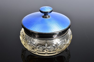 Lot 374 - A George V silver and enamelled powder puff lid on cut glass base
