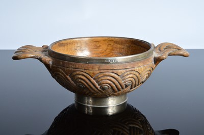 Lot 395 - An interesting Victorian provincial Scottish carved oak and silver mounted quaich by Ferguson & Macbean