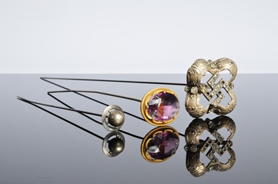Lot 494 - Three hat pins