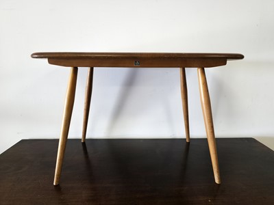 Lot 548 - A pair of c1970s Ercol coffee tables