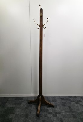 Lot 554 - An Arts & Crafts period oak coast stand