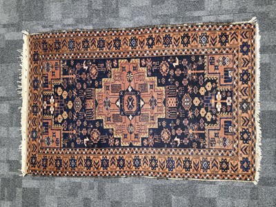 Lot 556 - An early 20th century Middle Eastern woollen carpet