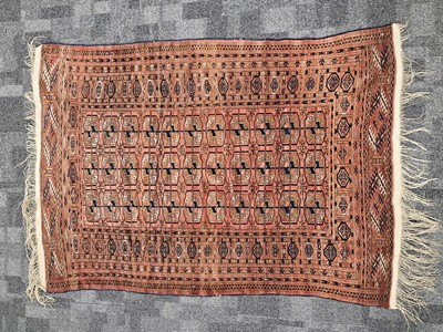 Lot 561 - A vintage Turkman Tekke woollen carpet