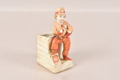 Lot 136 - A Ceramic Figural Matchstrike