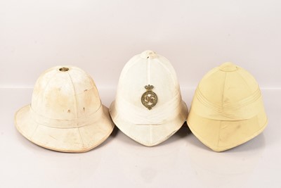 Lot 196 - A group of three Pith Helmets